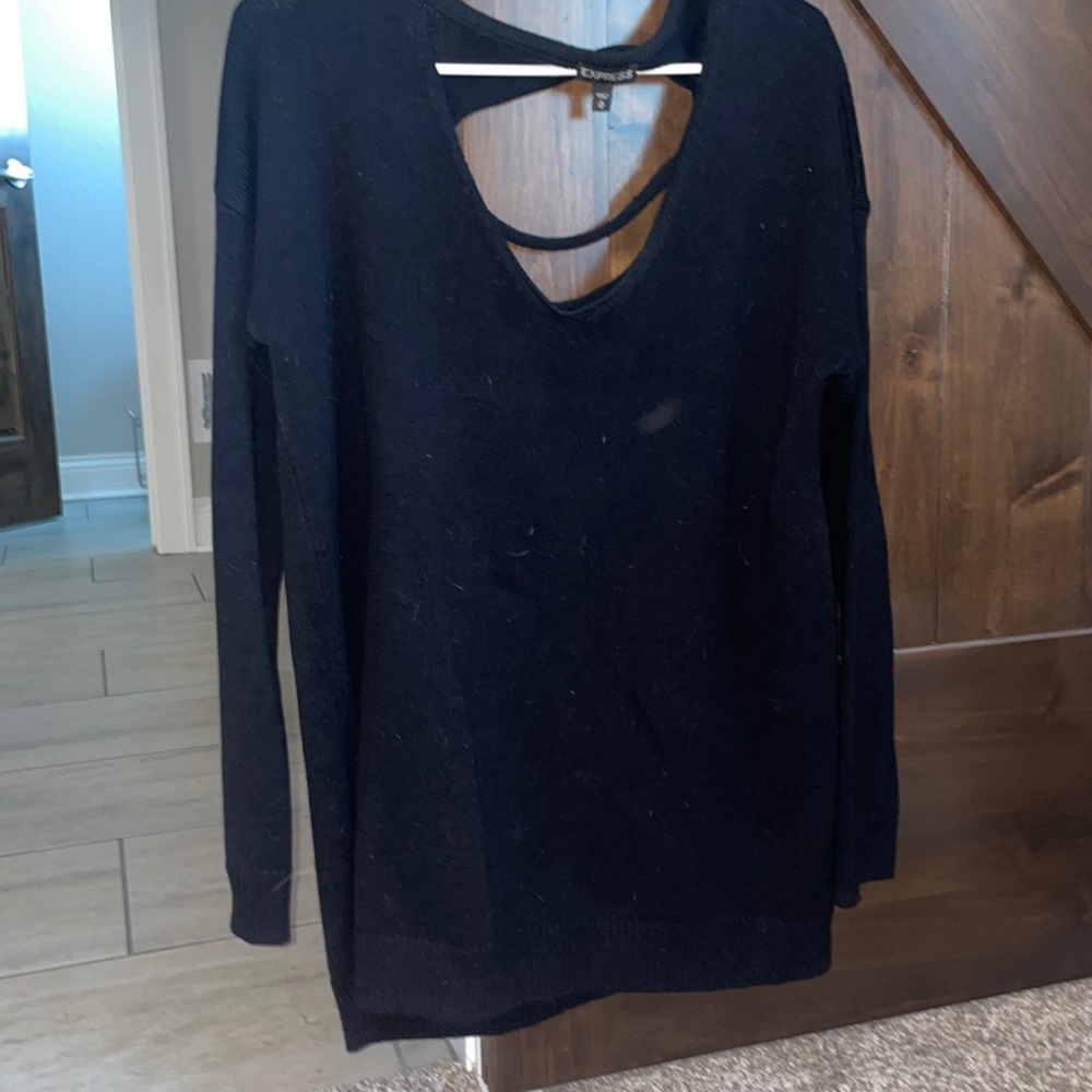 Like new sweater with fun back detail!
